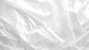 This image presents a closeup view of crumpled transparent plastic, showcasing its unique textured surface and abstract design, making it perfect for various creative applications and artistic uses photo