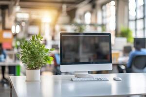 Picture a modern office with a neat desk, a sleek computer setup, and a vibrant potted plant, creating a professional environment that boosts productivity and focus for all who enter photo
