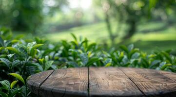 A beautifully crafted wooden table is set in a tranquil and vibrant green landscape, perfect for outdoor gatherings photo