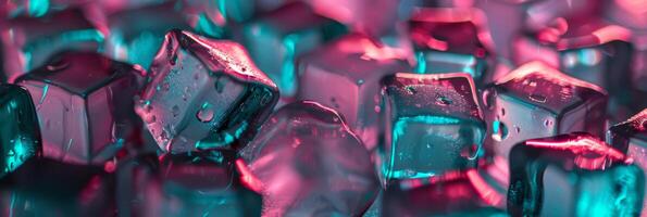 Vibrant ice cubes, beautifully illuminated with pink and teal colors, creating a stylish and refreshing visual effect photo