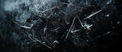 A stunning closeup of a frosty polycarbonate surface intricately displays numerous tiny ice crystals, collectively creating a truly enchanting winter scene that captivates and delights the senses photo