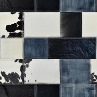 Combining a unique blend of highquality denim and authentic cowhide, this trendy patchwork design is perfect for modern apparel and creatively designed textiles in the fashion industry photo