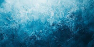 This captivating image showcases intricate frost patterns in stunning blue shades, creating an enchanting wintry atmosphere ideal for winterthemed projects or creative backgrounds photo