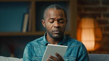 Pensive adult african american man indoors thinking deep in thoughts create strategy thoughtful businessman making notes in notebook planning searching for solution writing down idea write memories photo