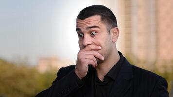 Disappointed hispanic caucasian loser businessman has financial problem covers face with hand feeling stress frustration experiencing unpleasant sadness facial emotion problem puts palm on head shame photo