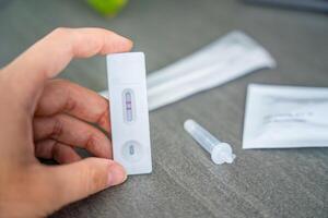 Rapid Antigen Test kit with with Positive result during swab COVID-19 testing. Coronavirus Self nasal or Home test, Autumn exacerbation of viruses. High quality photo