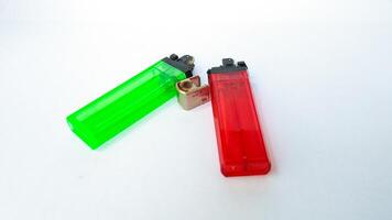 2 broken gas lighters with isolated white background photo