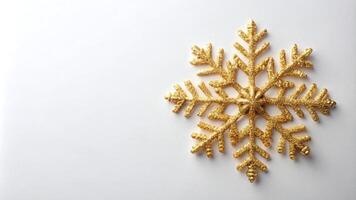 Golden Snowflake Against a White Background photo