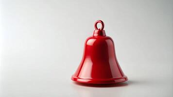 Single Red Christmas Bell on a Plain White Background photo