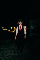 A mysterious figure, disguised as an assassin in a suit with wild hair, wields a menacing axe, embodying the very essence of fear and danger photo