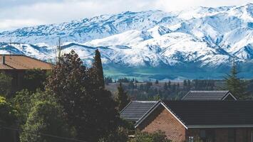 Snow covered mountains close up in Alexandra new Zealand iconic scenery photo