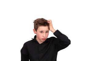 I have no idea. Portrait of a confused boy, feeling insecure, not knowing the answer. photo