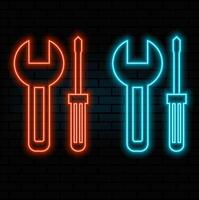 Neon sign tools. Wrench and screwdriver. The concept of repair, call the master, service tool. Glowing neon sign on a dark background. vector