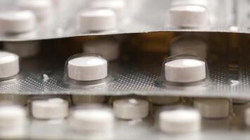 Close up of pills of blister pack on table video