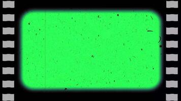 A vintage 35mm film frame with scratches, sprockets and dirt on a seamless loop that can be used as a background frame or composited as an overlay with a screen blending mode. video