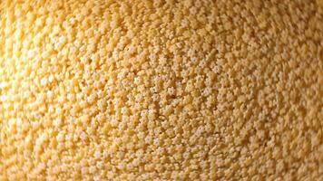 Uncooked Stelline Pasta. A Culinary Canvas of Stelle Macaroni, Creating a Lively and Textured Background for Gourmet Cooking - Top View, Rotating. Turning Dry Pasta. Raw Macaroni - Rotation video