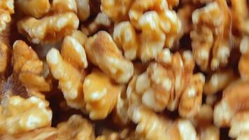 Scattered Shelled Walnuts - Top View, Rotating. Turning Walnut Background. Natural High-Calorie Snacks - Side Rotation video