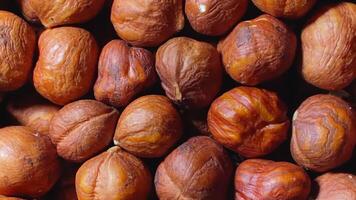 Scattered Peeled Hazelnuts - Top View, Rotating. Turning Hazelnut Background. Natural High-Calorie Snacks - Rotation video
