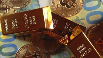 Shiny Gold Bars with Bitcoin on the 100 Euro Bills - Top View. Euro Money Currency. Hundred Euro Banknotes. Success, Finances, Cryptocurrency and Wealth Concept - Slow Rotation Right video