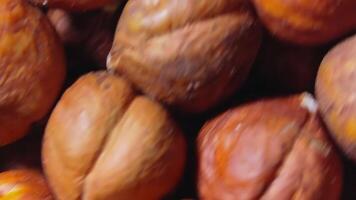 Scattered Peeled Hazelnuts - Top View,Rotating. Turning Hazelnut Background. Natural High-Calorie Snacks - Angular Rotation video