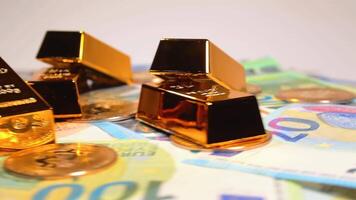 Fine Gold Bars with Bitcoin Coins on the Different Euro Banknotes Rotating. Euro Currency. Colored Paper Money. A Lot of Euro Cash. Income, Earnings, Cryptocurrency, Money Saving and Wealth Concept video