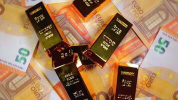 Shiny Gold Bars on the 50 Euro Bills - Top View. Euro Money Currency. A Lot of Fifty Euro Banknotes. Success, Finances and Wealth Concept - Slow Rotation Left video
