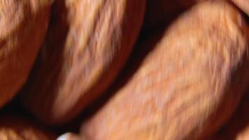 Scattered Almonds - Top View, Rotating. Turning Almond Nuts Background. Natural High-Calorie Snacks - Side Rotation video
