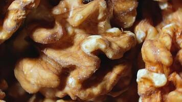 Scattered Shelled Walnuts - Top View, Rotating. Turning Walnut Background. Natural High-Calorie Snacks - Rotation video