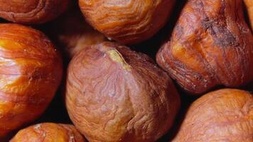 Scattered Peeled Hazelnuts - Top View, Rotating. Turning Hazelnut Background. Natural High-Calorie Snacks - Rotation video