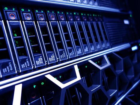 A close up of a server rack with many different types of servers photo