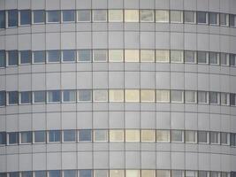 A building with many windows and a clock on it photo