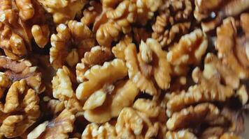 Scattered Shelled Walnuts - Top View, Rotating. Turning Walnut Background. Natural High-Calorie Snacks - Side Rotation video