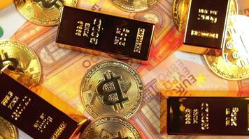 Shiny Gold Bars with Bitcoin on the 50 Euro Bills - Top View. Euro Money Currency. A Lot of Fifty Euro Banknotes. Success, Finances, Cryptocurrency and Wealth Concept - Slow Rotation Left video