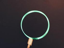 A green light is shining through a circle photo