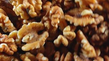 Scattered Shelled Walnuts - Top View, Rotating. Turning Walnut Background. Natural High-Calorie Snacks - Side Rotation video