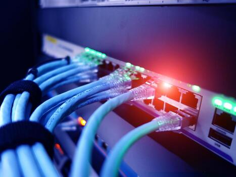 A close up of a network cable connected to a server photo