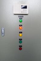 A control panel with several buttons and lights photo
