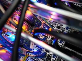 A close up of a computer server with many wires photo