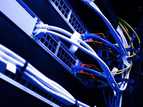 A close up of a network server with wires photo