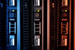A row of servers with different colored lights photo