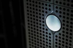 A close up of a white button on a black server photo