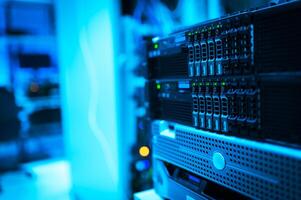 A server rack with several servers in a room photo