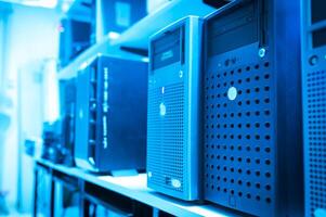 A row of computer servers in a room photo