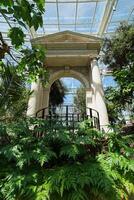 Architecture of terrace patio and natural fountain decorated in Climatron geodesic conservatory dome at Missouri Botanical garden- St.Louis town, MO photo