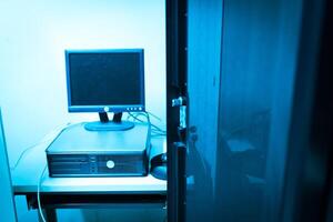 A computer monitor sitting on a desk photo