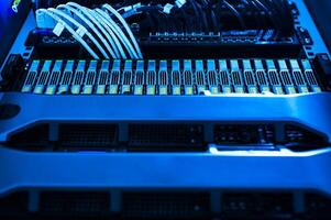 A close up of a computer with wires and cables photo