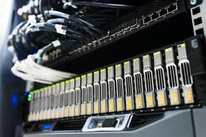 A server rack with many different types of servers photo