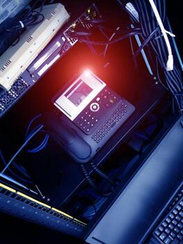 A computer with a phone and a keyboard photo