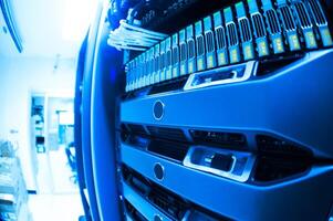 A close up of a server rack with many different types of servers photo