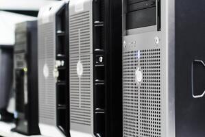 Several computer servers are lined up in a row photo